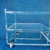 Translucent plexiglass storage drawer/cabinet on wheels.