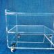 Translucent plexiglass storage drawer/cabinet on wheels.