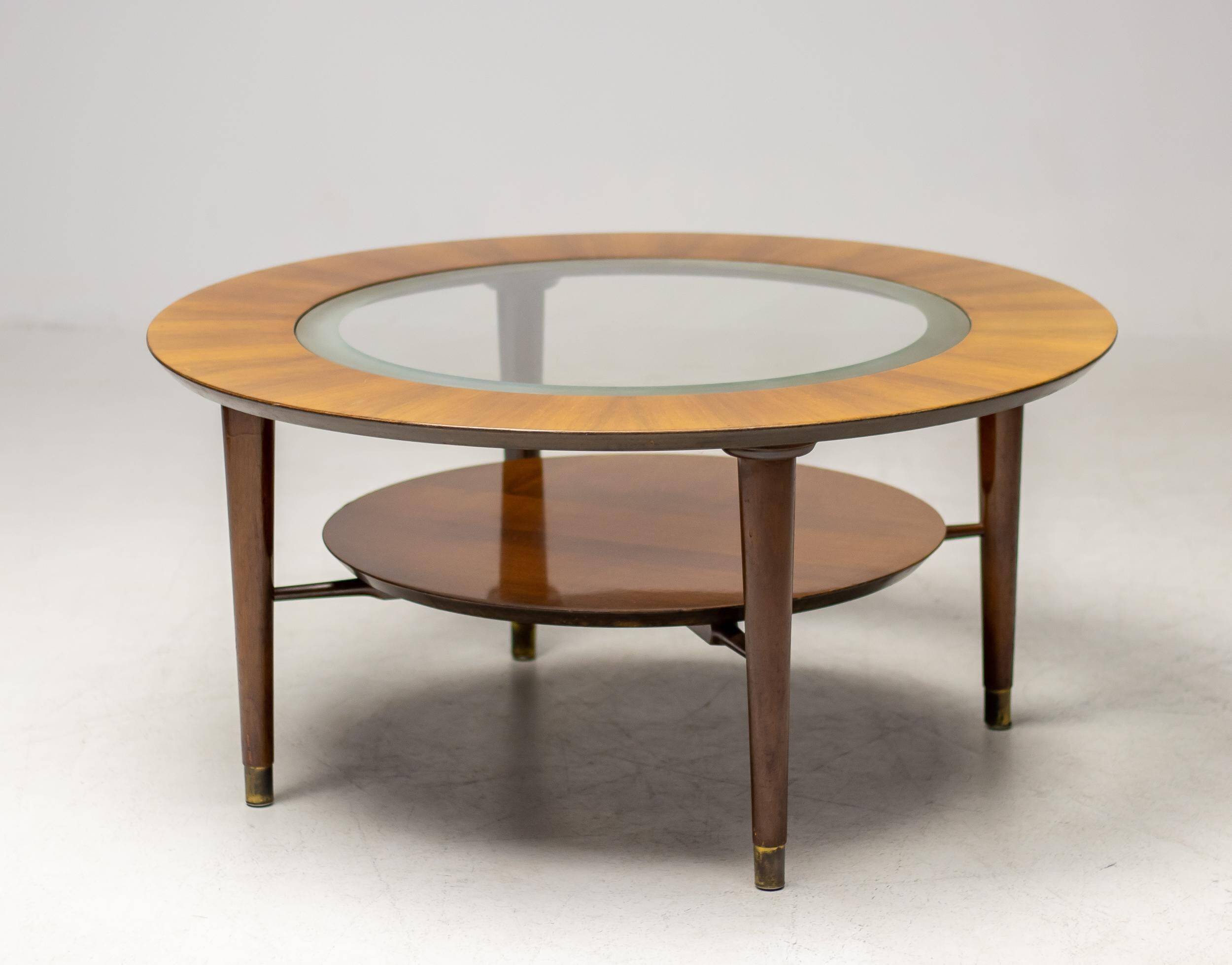 Sculptural coffee table in walnut and glass, Italy, 1950.