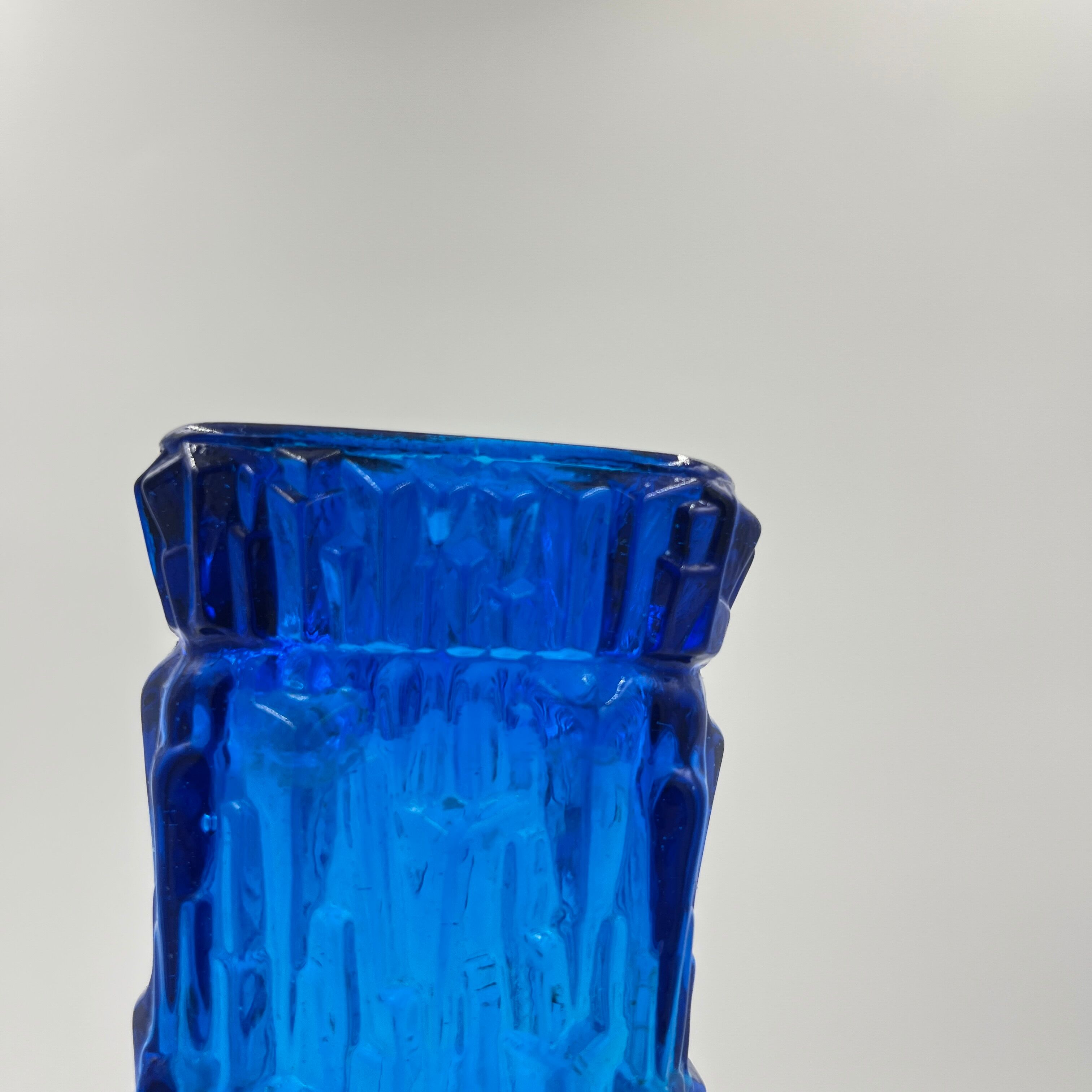 Blue glass vase with relief