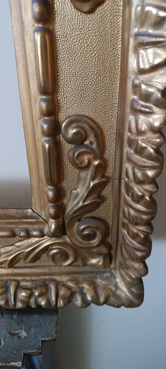 Miroir ancien en bois doré