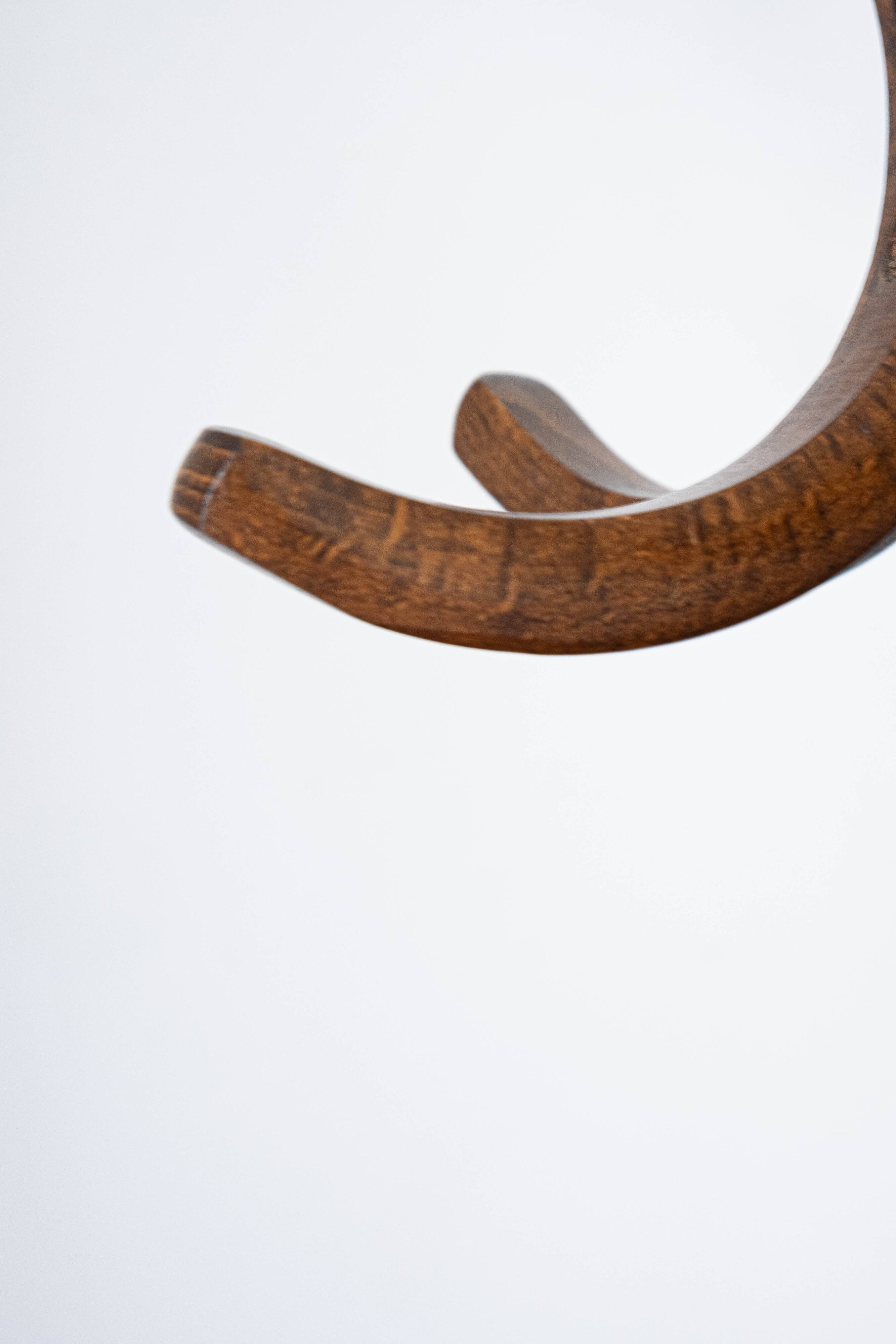 Baumann swivel parrot coat rack, dark wood.