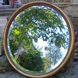Old beveled round mirror