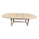 Large oval table in stripped solid oak with turned legs, 2 extensions.