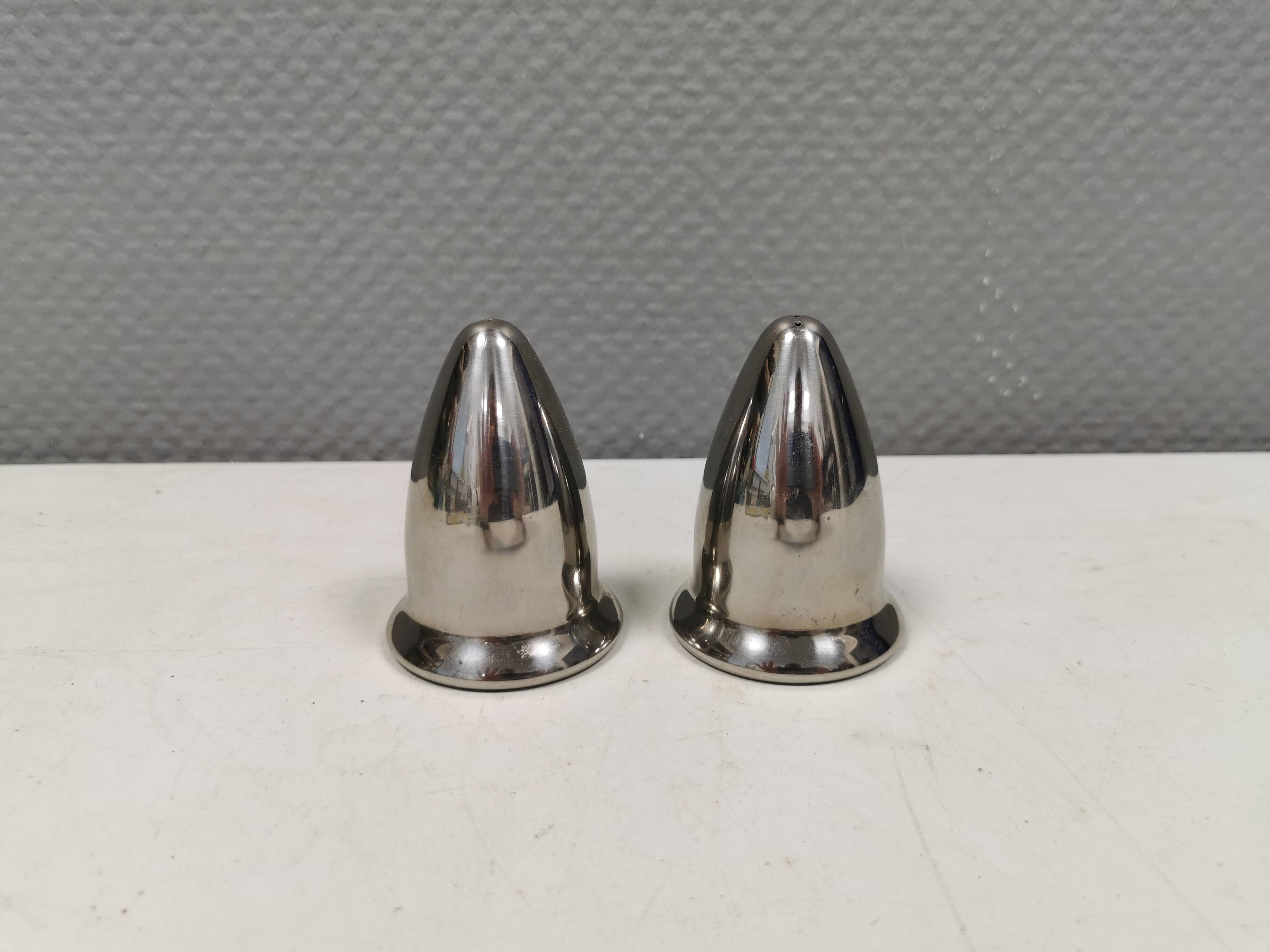 A beautiful stainless steel salt and pepper set, space age style 1980s.