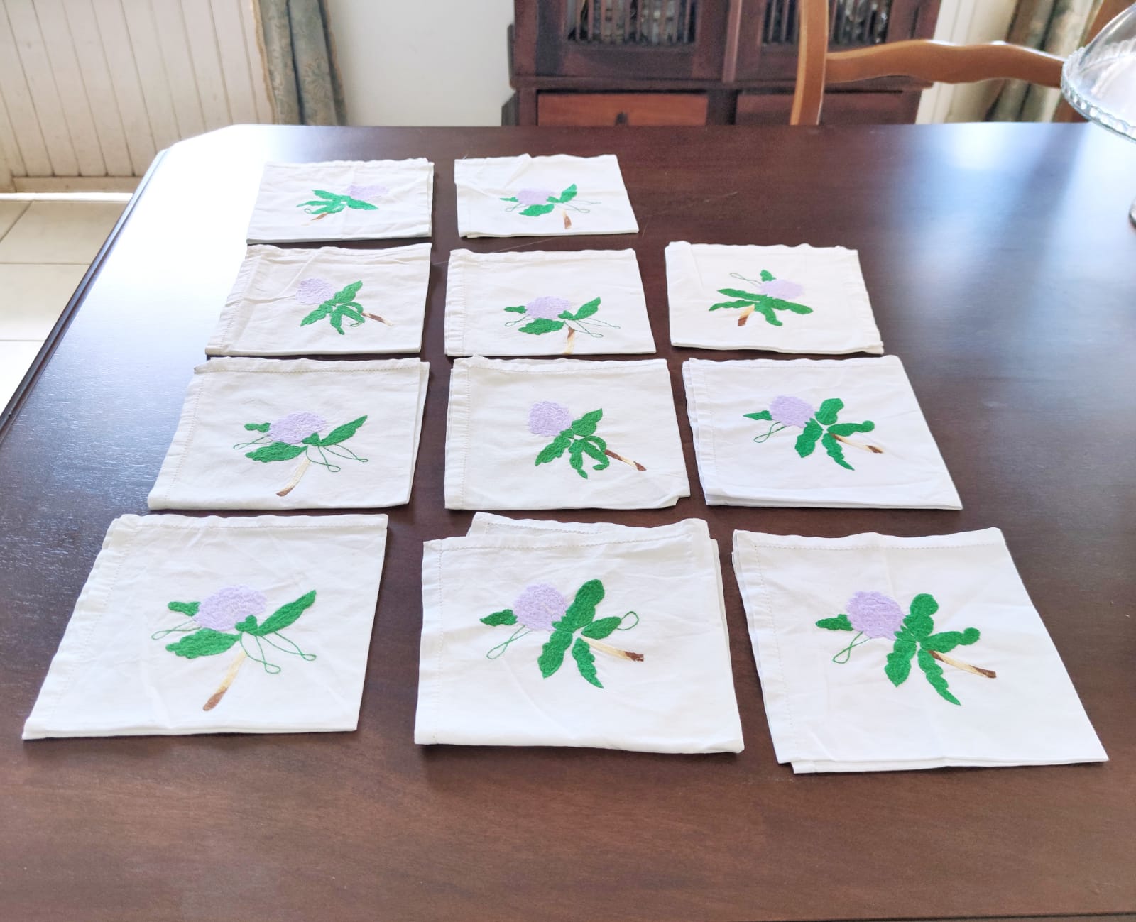 11 hand-embroidered antique table towels