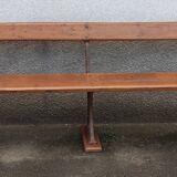 Old wooden bench with cast iron base