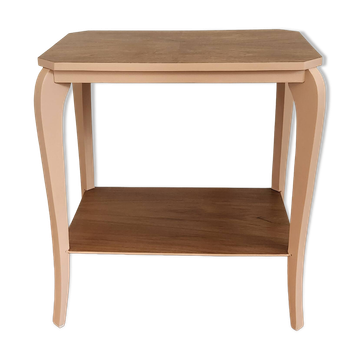 Side table with curved pink legs