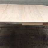 Round table with two raw cherry wood extensions
