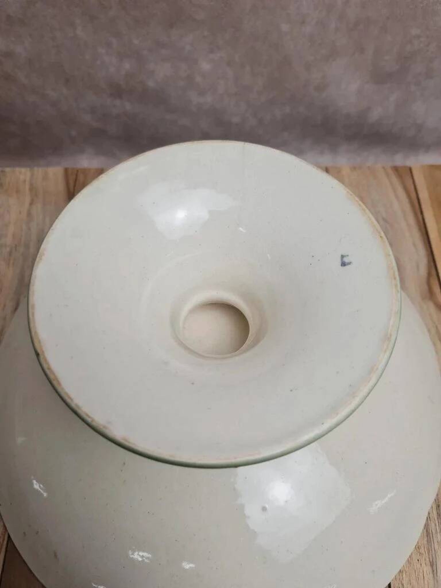 Antique compote stand Lunéville St Clément with green clover decoration.