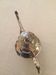 Silver metal pourer with rocker decoration