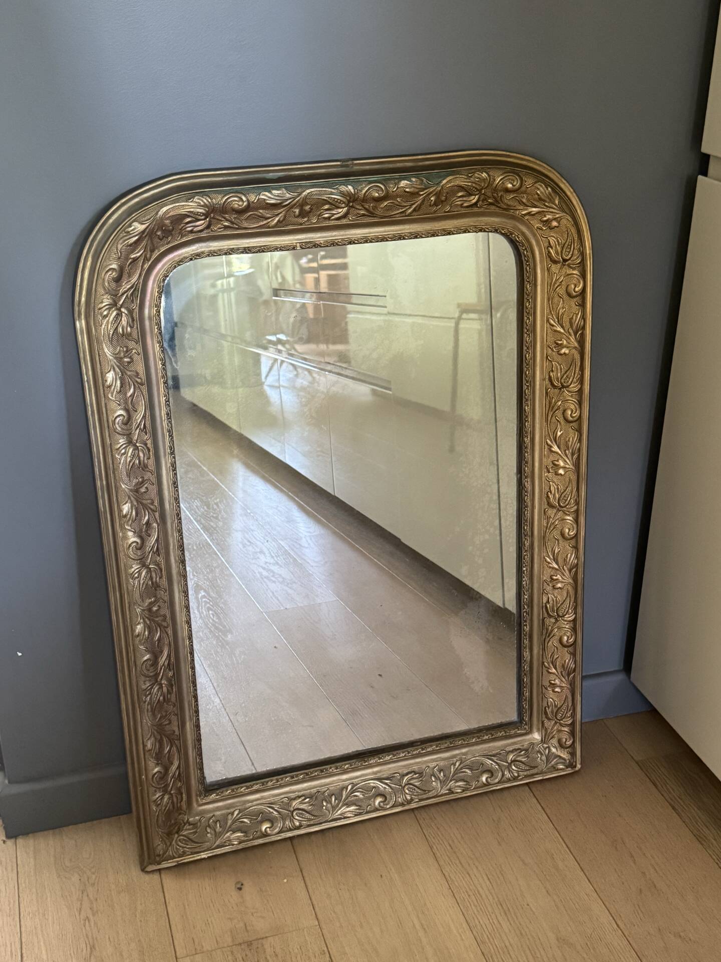 Golden mirror with mouldings
