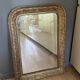 Golden mirror with mouldings