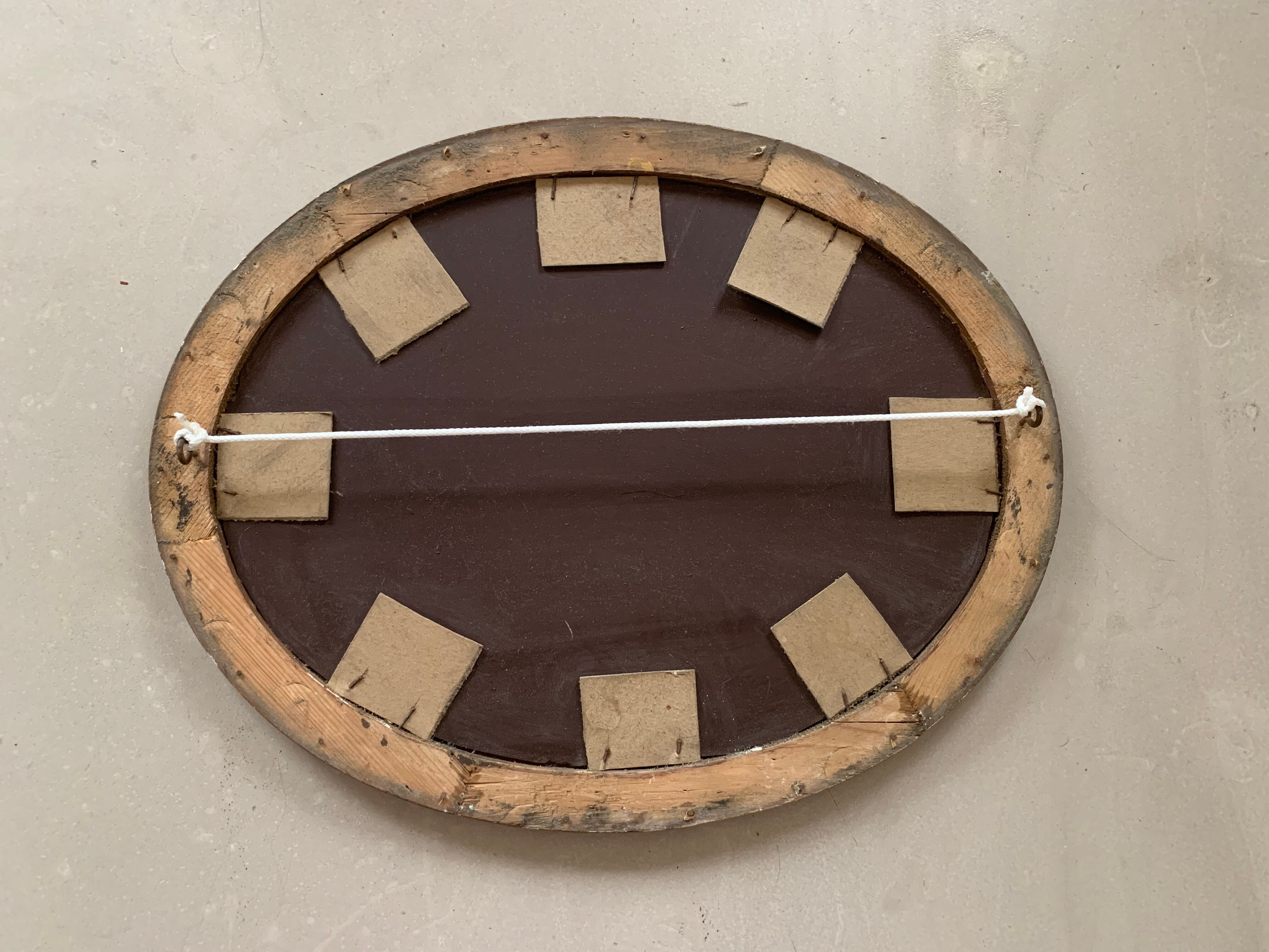 Old oval mirror stitched