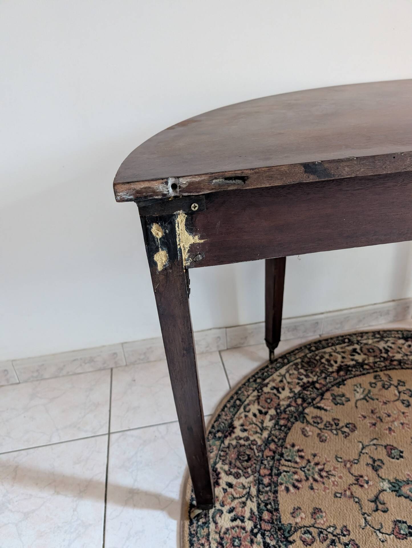 Old half-moon table or serving trolley on wheels