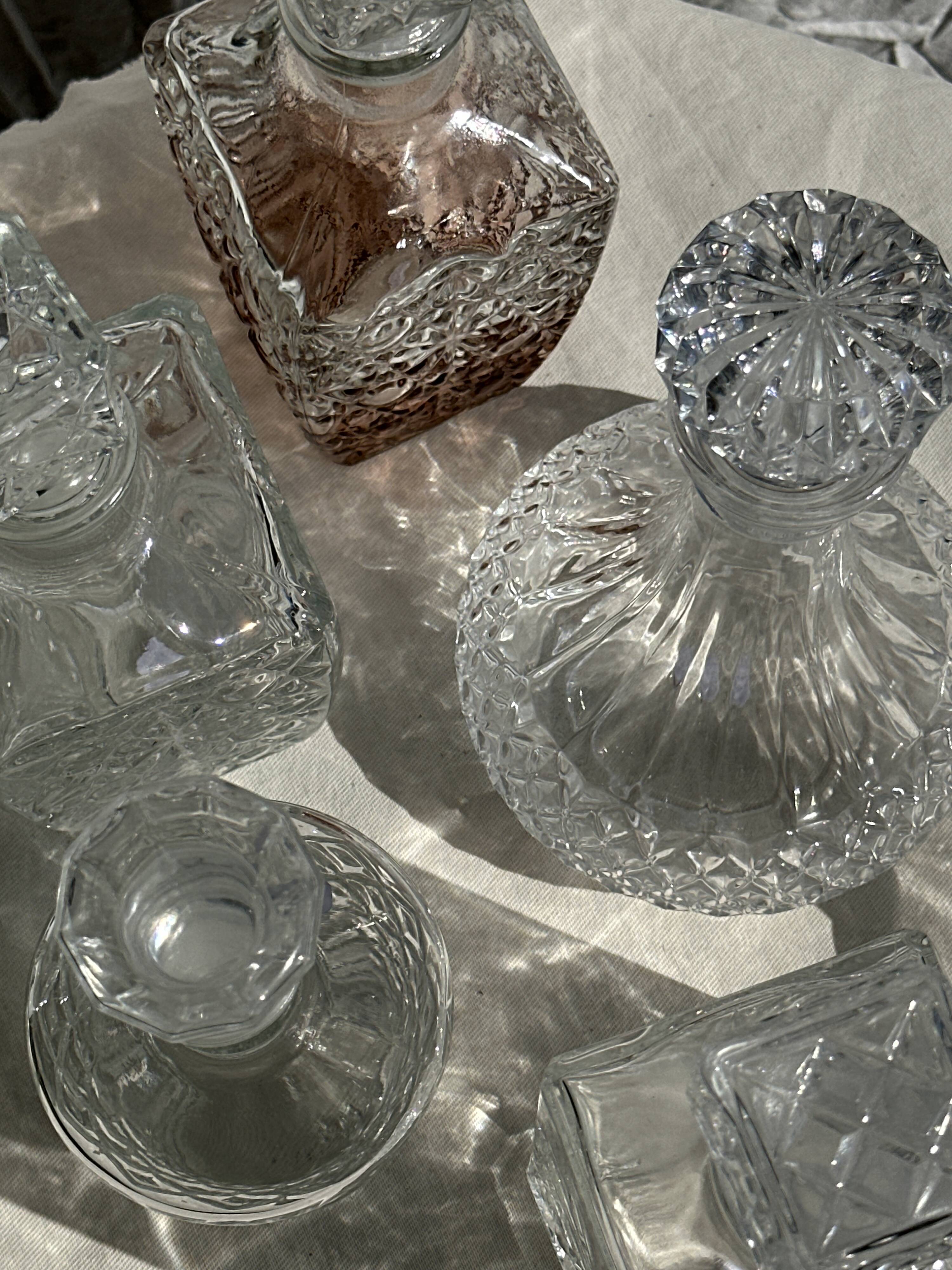 Small cylindrical glass whiskey decanter H:23