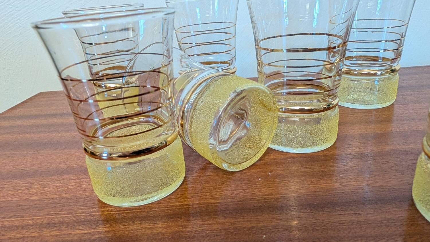 70s vintage glass with gold decoration and a speckled base.