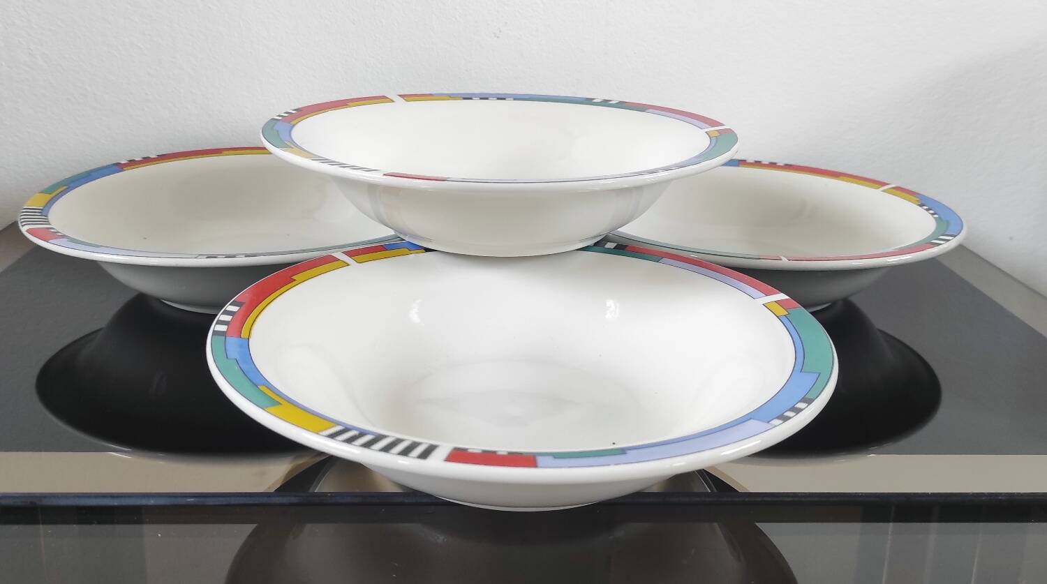 Set of 4 vintage Memphis style deep plates.