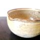 Beige glazed terracotta caquelon