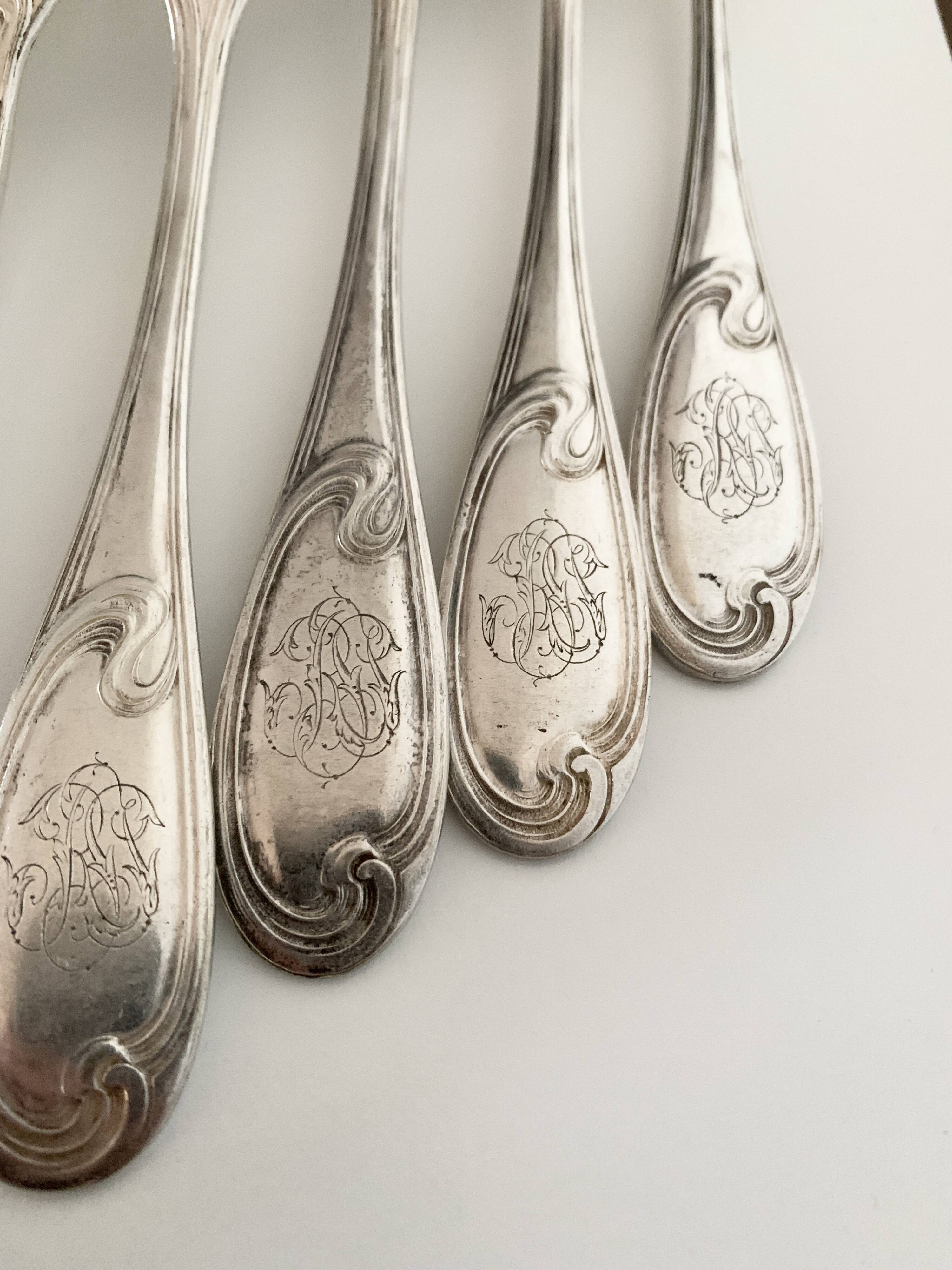 Nine large Ercuis silver-plated forks
