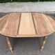 Renovated 18th century solid wood extendable round dining table with shutters