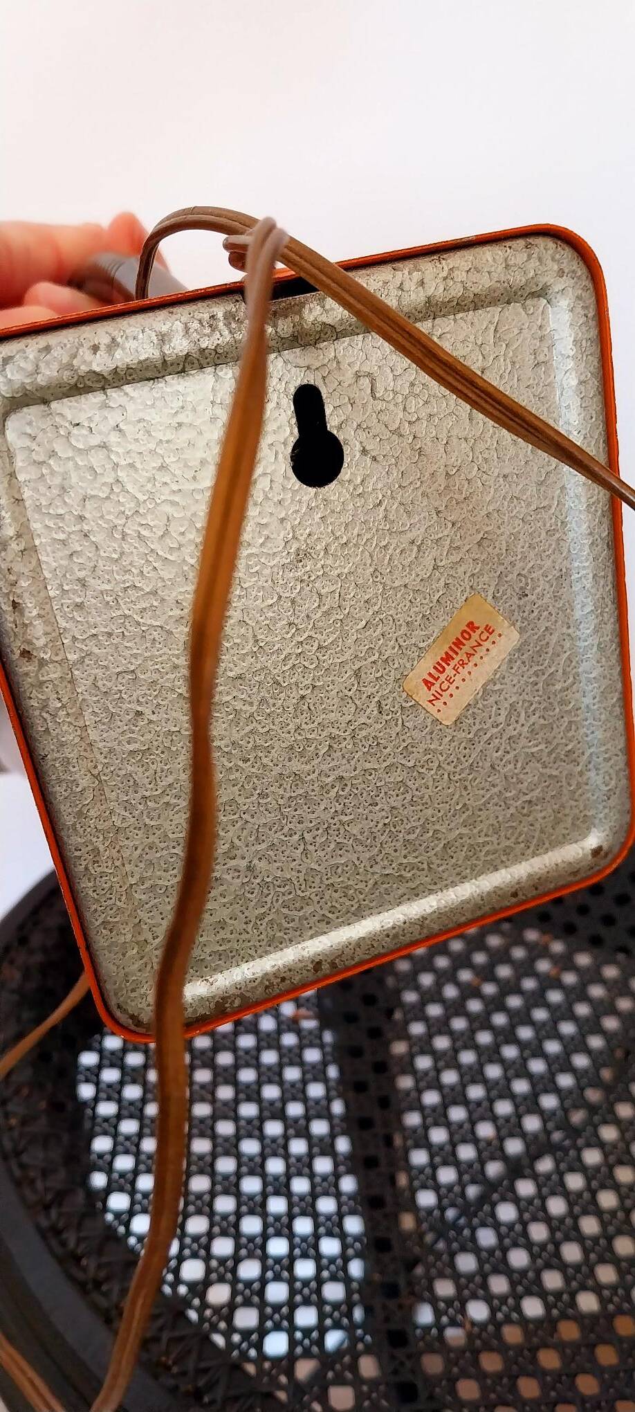 Orange metal lamp from the 60s and 70s.