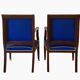 Pair of Empire style armchairs in mahogany and gilt bronze.