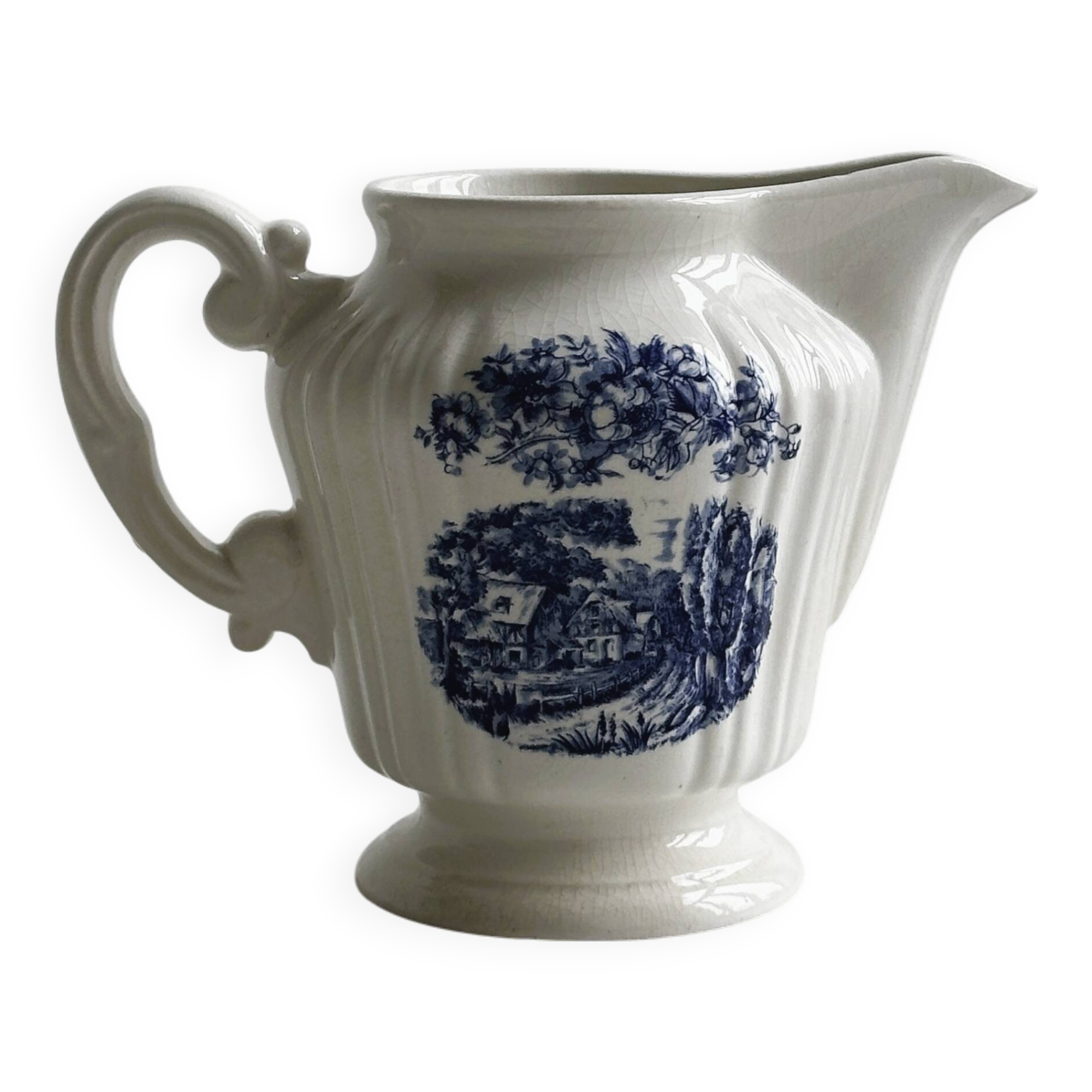 Porcelain sauce boat with blue pastoral pattern