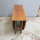 Table en teck dite "Gateleg"
