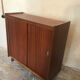 Vintage storage cabinet teak veneer sliding door compass feet