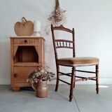 Antique chair turned wood sitting velvet flowers