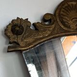 Antique wooden mirror with an unusual shape