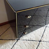 Lacquered black chest of drawers, golden brass