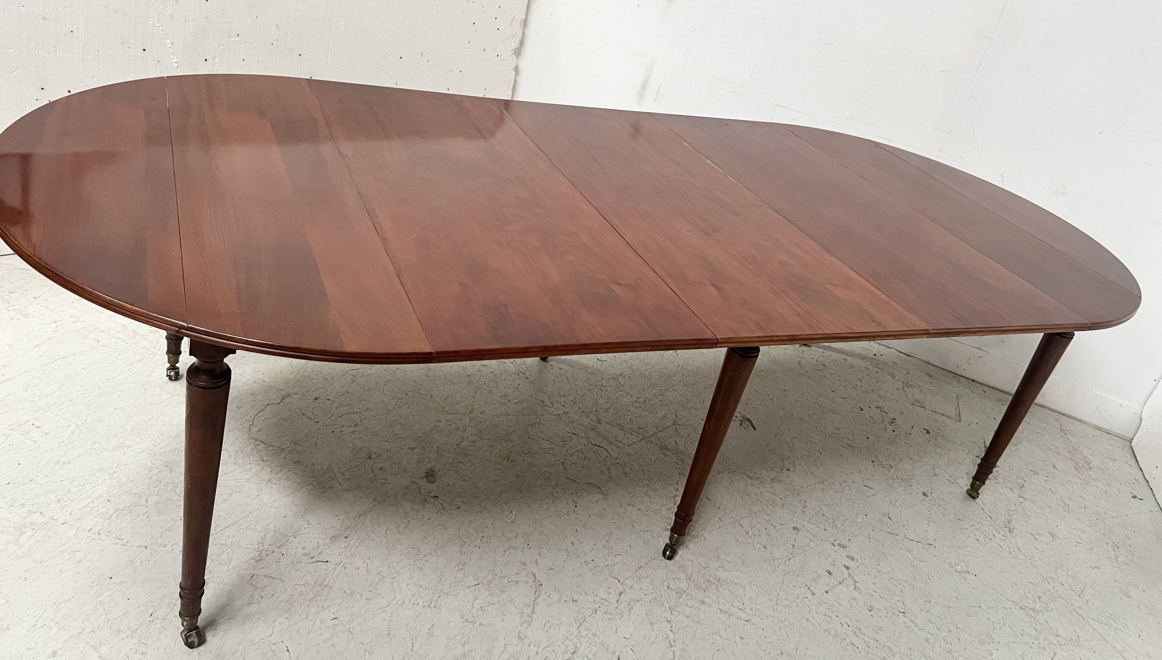 A six-foot Louis XVI style mahogany table from the 19th century.