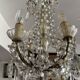Small antique chandelier with tassels and bronze from the early 20th century