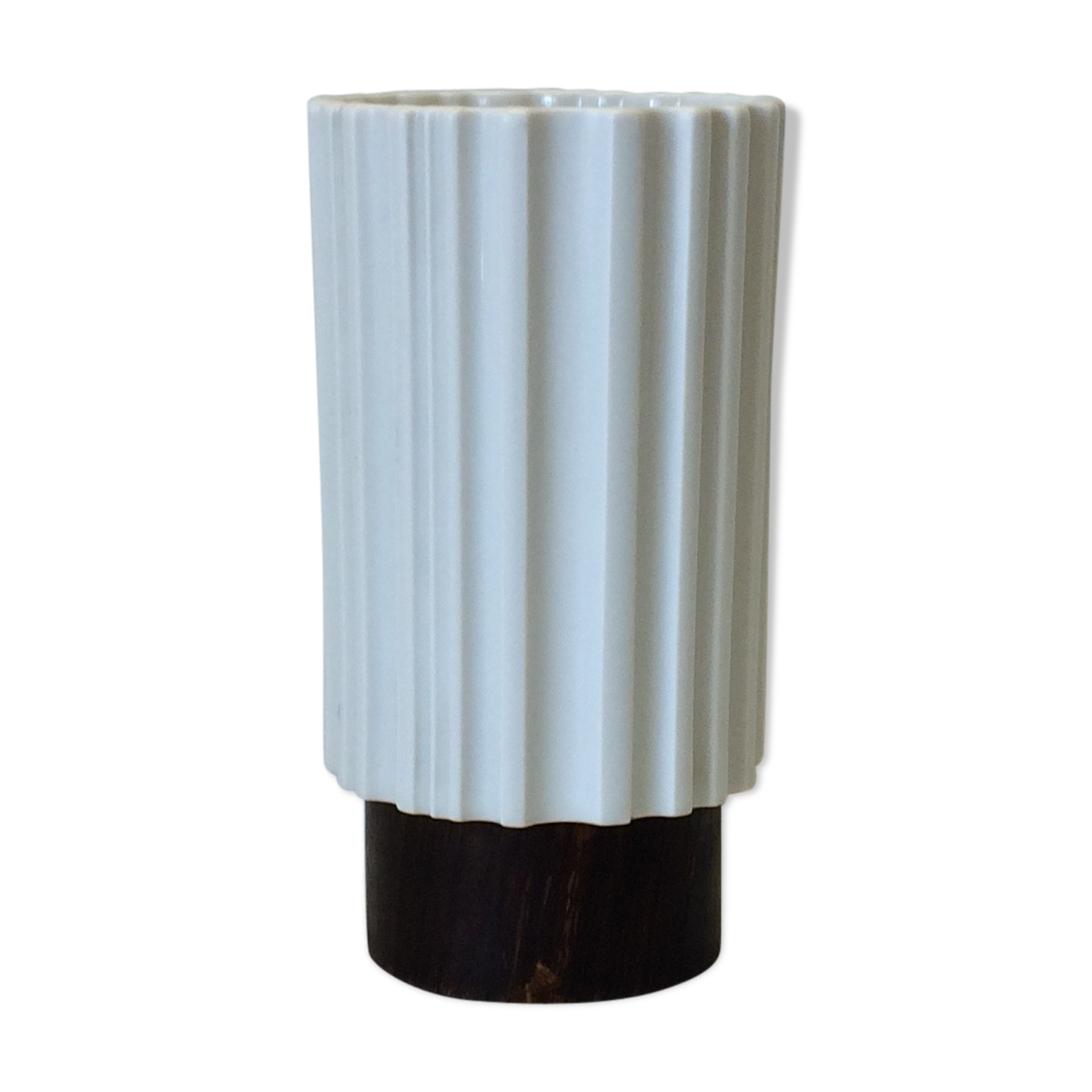 White vase on wooden base