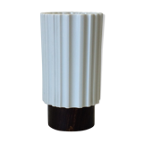 White vase on wooden base