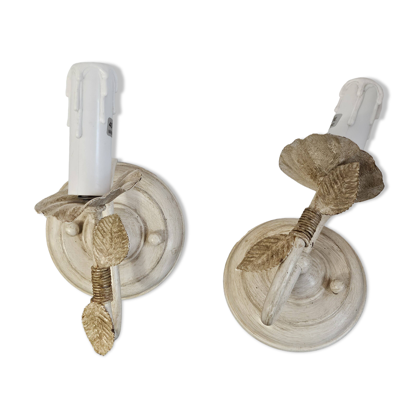 Pair of cream patinated metal wall sconces with floral decoration.
