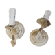 Pair of cream patinated metal wall sconces with floral decoration.