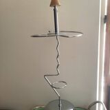 Designer umbrella stand in chrome metal and wood.