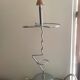 Designer umbrella stand in chrome metal and wood.