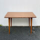 Wooden coffee table with compass leg