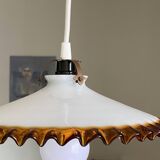 Old pendant light with a white opaline glass shade and a wavy border.