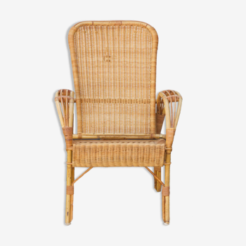 Rattan armchair with reclining backrest