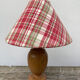 Wooden lamp and vintage red and green striped lampshade