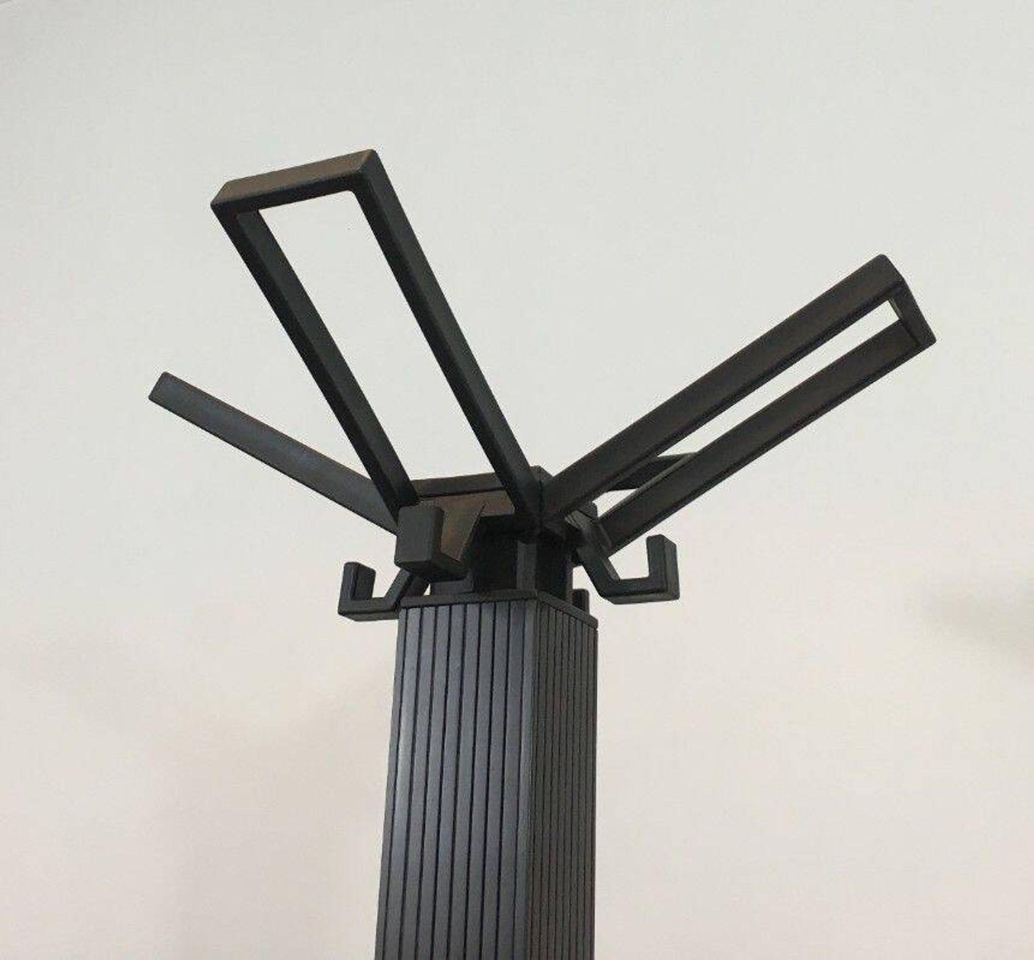 Michele De Lucchi & Tadao Takaichi for Kartell. Black plastic coat rack "Segmenti". Italy. 1989