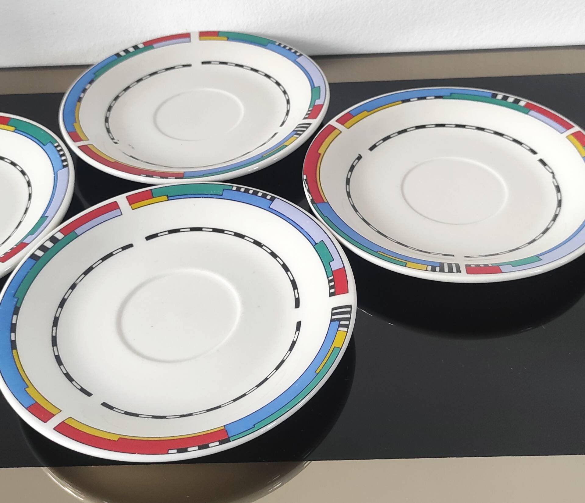 Set of small plates, vintage saucers in porcelain.