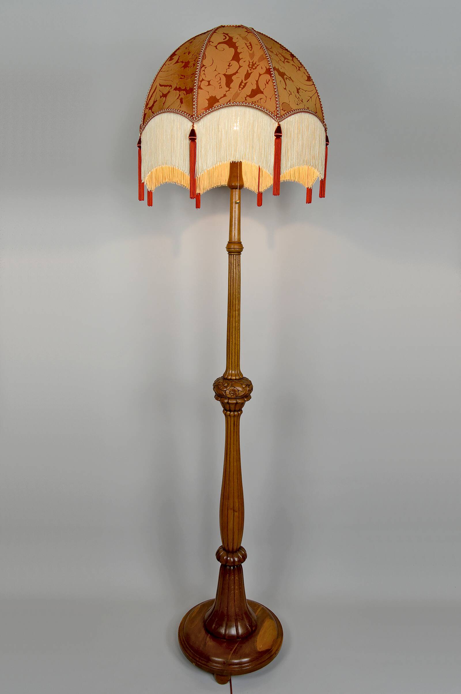 Important Art Deco carved oak floor lamp, France, circa 1920
