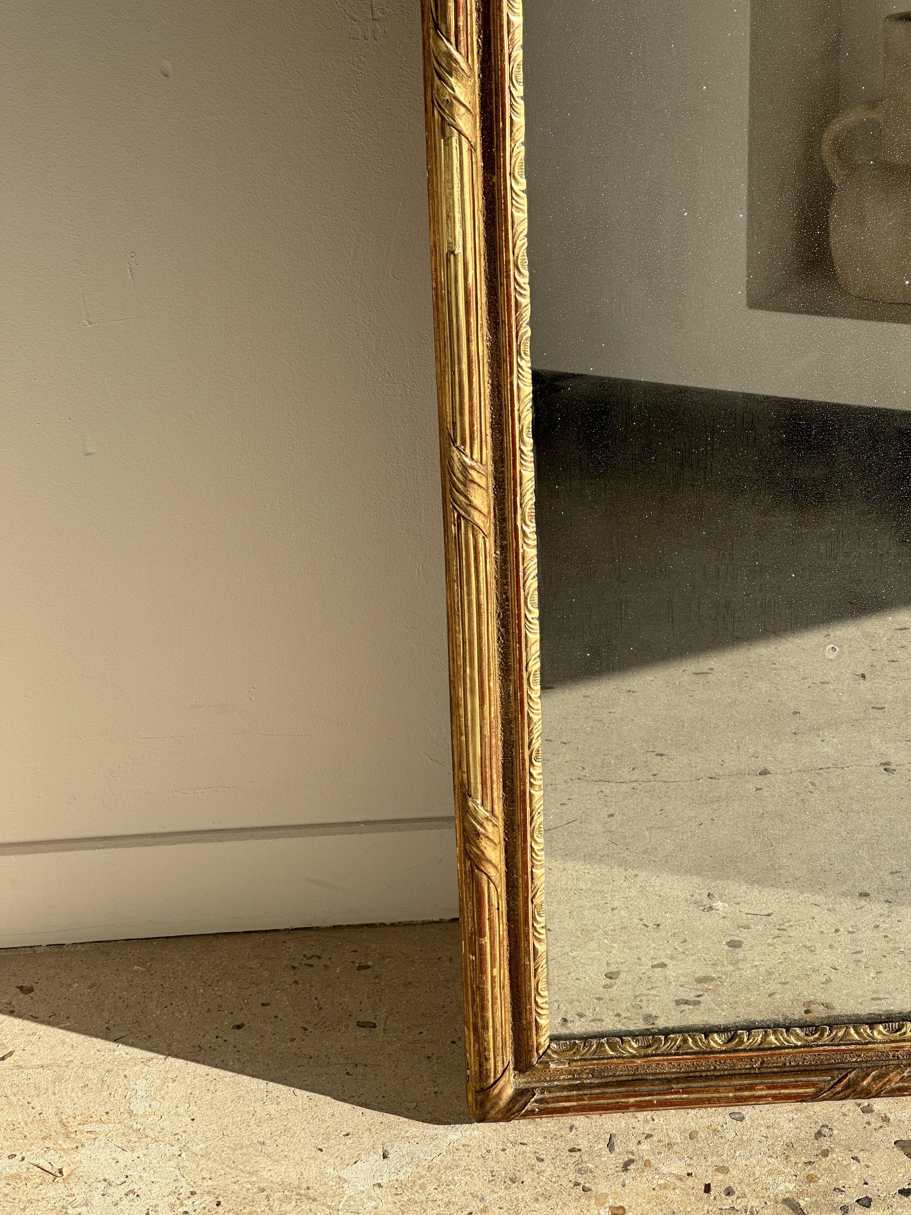 Large gilded mirror 19th century rounded corners mercury glass Louis XVI style