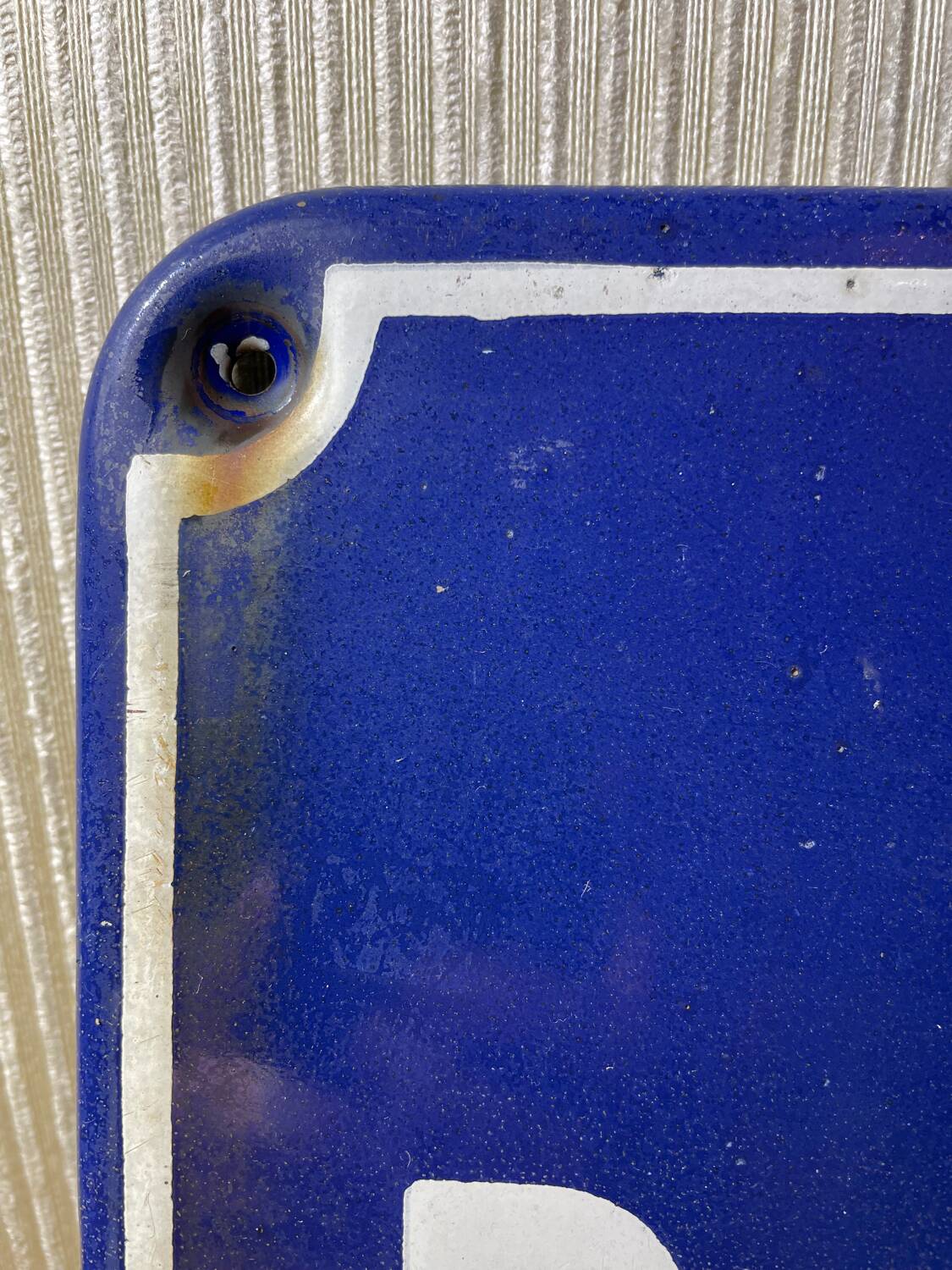 Enameled sheet metal street sign